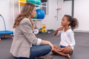 Speech therapist engaging with a child at Daisy Kids Therapy Clinic in Houston, TX.